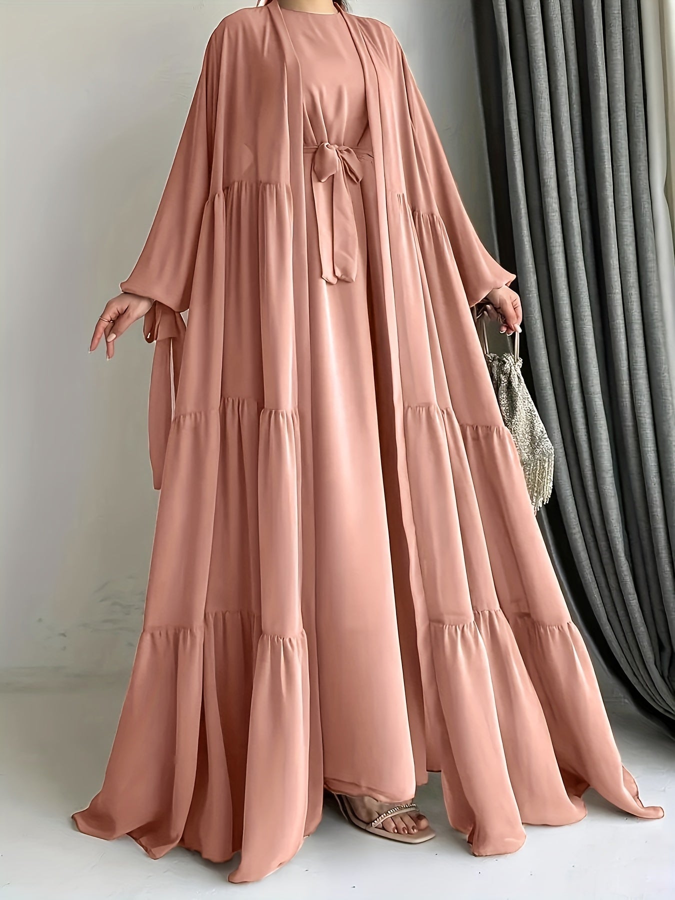 A stylish Middle Eastern Abaya set with vest and belt, featuring a chiffon H-Line robe with side split, lantern sleeves, and ruffle hem detail - perfect for all seasons.