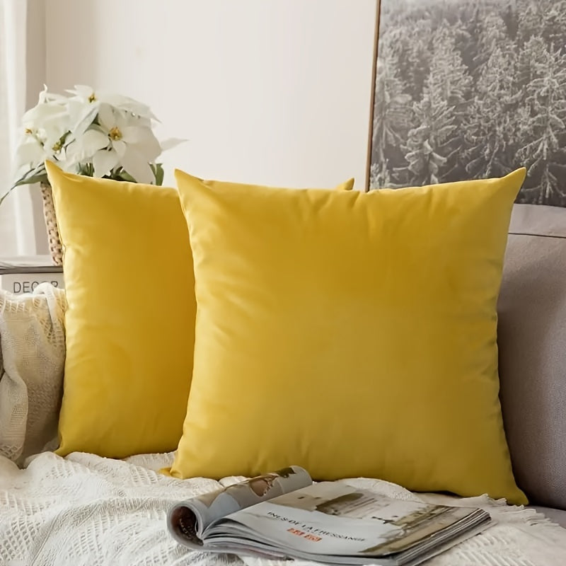 Two golden velvet throw pillow covers, 18x18, for couch or bed.