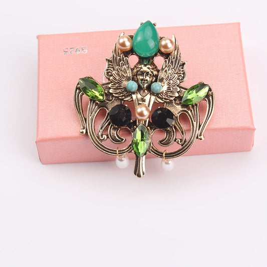 Sophisticated Vintage Emerald Baroque Pearl Brooch with Regal Hollow Carving - Exquisite Design for Coats and Formal Attire, Ideal Accent for Elegant Occasions.