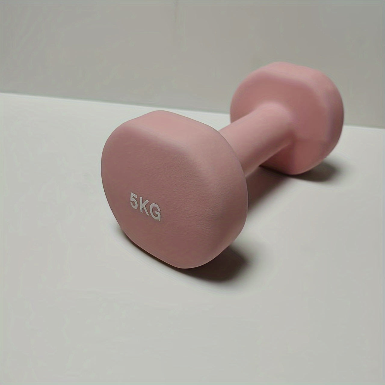 1pc 2kg dumbbell in pink/blue/black colors, made of solid cast iron for home gym. Durable and stylish fitness accessory for both men and women.