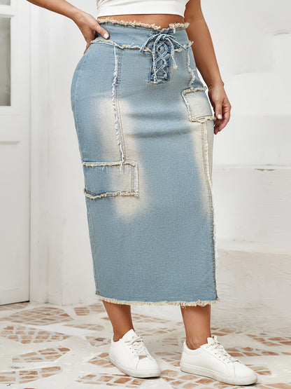 Women's high-waist denim midi skirt with frayed hem and lace-up details in a gradient light blue to dark wash. Raw edge detailing, versatile for spring/summer/fall.