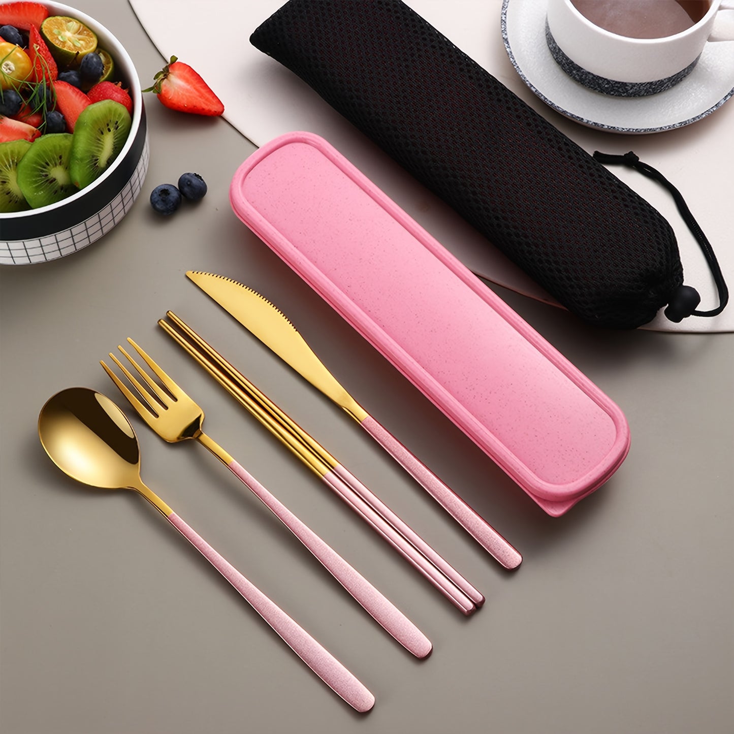 Stainless steel cutlery set includes knife, fork, spoon, and chopsticks in portable case for picnics, camping, lunches, and gatherings.