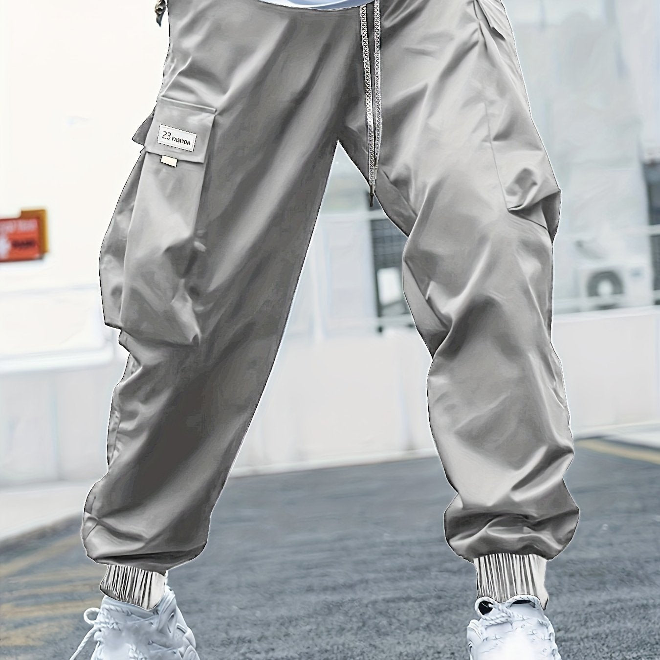 Men's plus-size cargo pants with letters print, multiple pockets, ideal for outdoor activities.