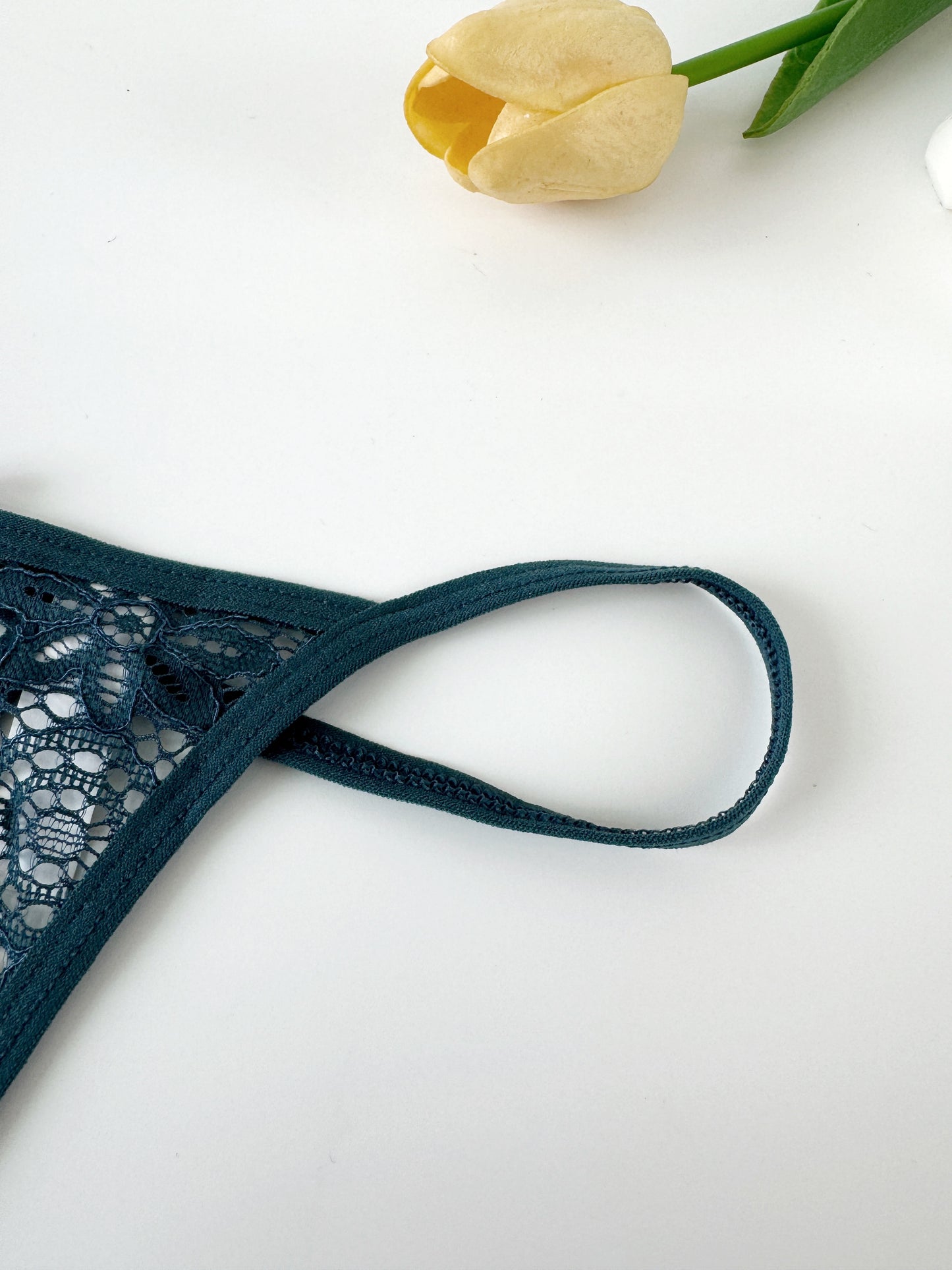 New thin strap low waist thong with lace, bowknot, and see-through design for a comfortable and breathable fit.