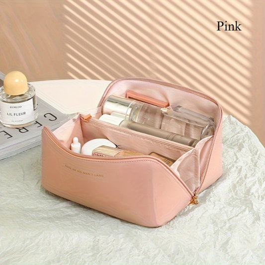 Elegant pink travel makeup bag with dividers, large capacity, waterproof, and formaldehyde-free. Suitable for skincare and makeup essentials. Durable and portable toiletry storage.