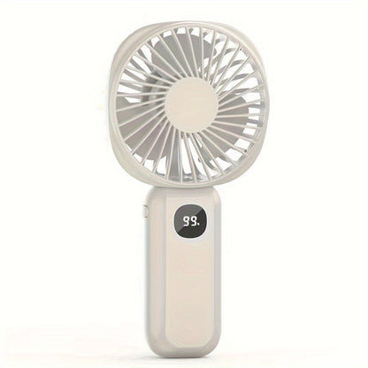 This portable handheld fan features a built-in battery capacity display and can be powered by USB or batteries. It also doubles as a convenient phone holder and is compact and easy to transport. Perfect for both handheld and desktop use, this fan is a