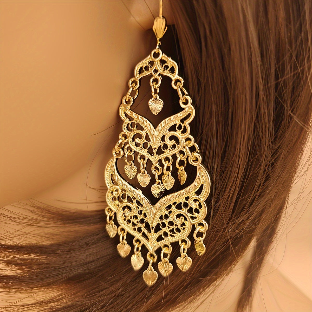 Pair of women's fashion earrings with retro large tassel and long dropping metal hollow design, perfect for banquet and festival celebrations inspired by Middle Eastern fashion.