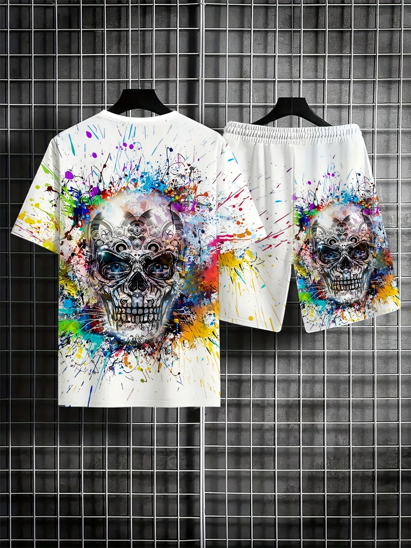 Men's plus size 2-piece set with skull print crew neck t-shirt and drawstring pocket shorts in 100% polyester knit fabric with slight stretch and regular sporty fit. Features vibrant paint