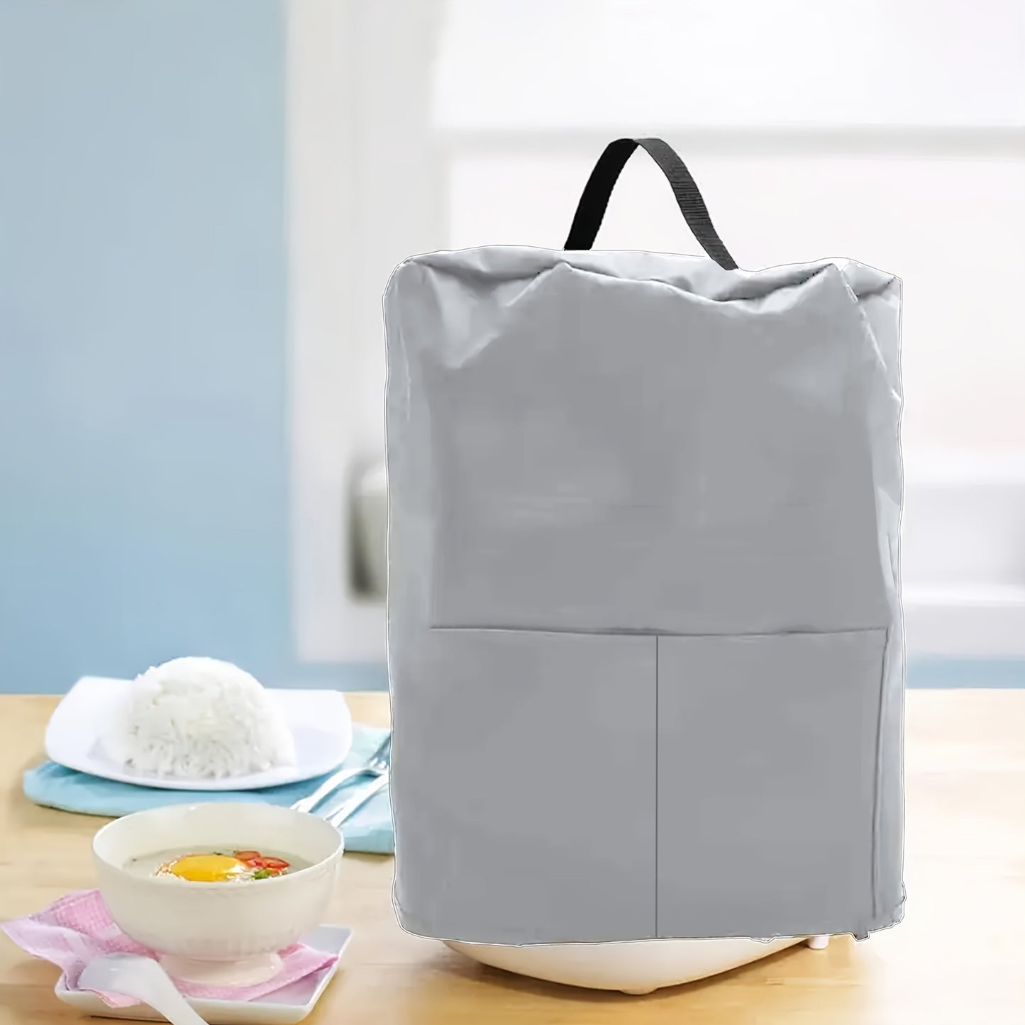 Protect your kitchen appliances with this versatile Rice Cooker Cover. Featuring a pocket and handle for easy transportation, this dust cover is suitable for electric pressure cookers, air fryers, steamers, and more. Keep your appliances safe and clean