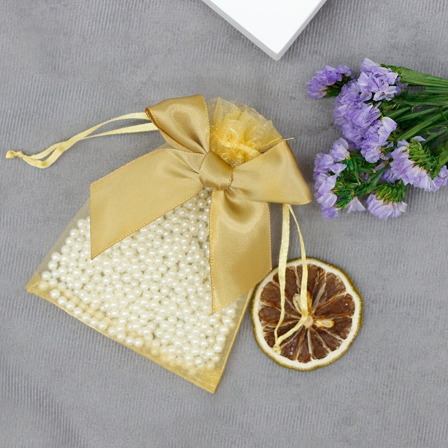 10 elegant organza bags with ribbon and bow, ideal for gift wrapping and party favors.