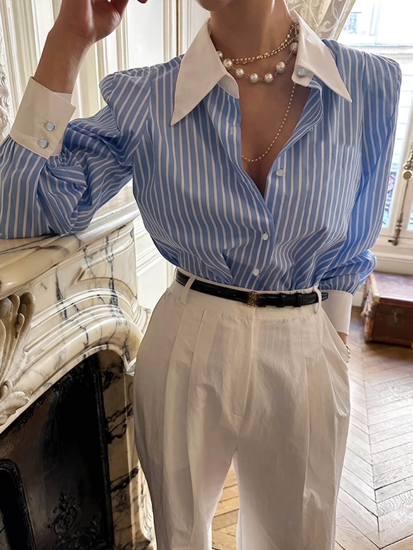 Elegant blue and white striped button-up shirt with neat collar, long sleeve, made of polyester, machine washable. Perfect for office and casual wear, ideal for New Year's celebrations.