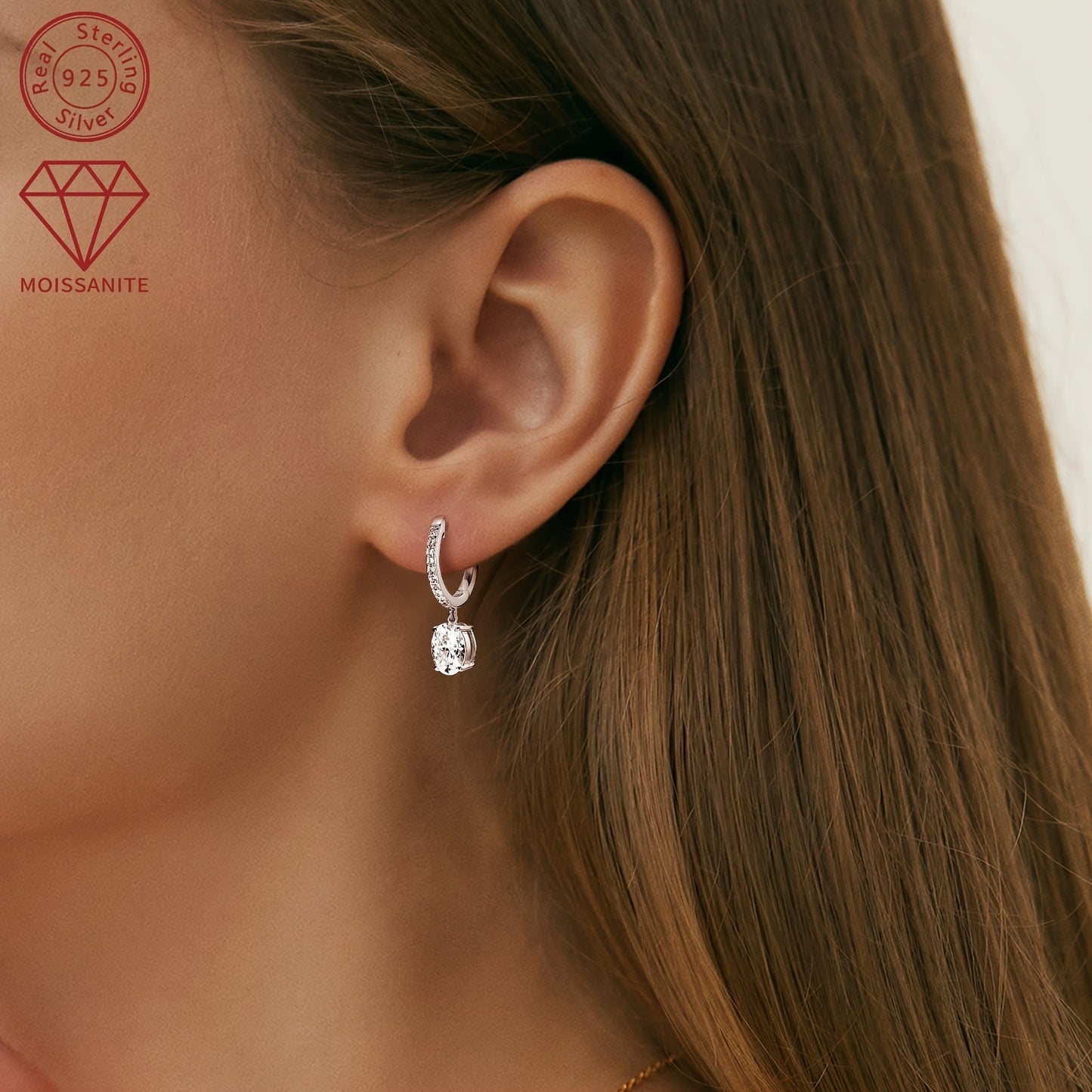 These exquisite silver earrings feature a pair of synthetic moissanite stones, each weighing 1.5ct. The main stones are 6x8mm in size, giving off a dazzling sparkle. These dangling earrings are perfect for adding a touch of glamour to any outfit.