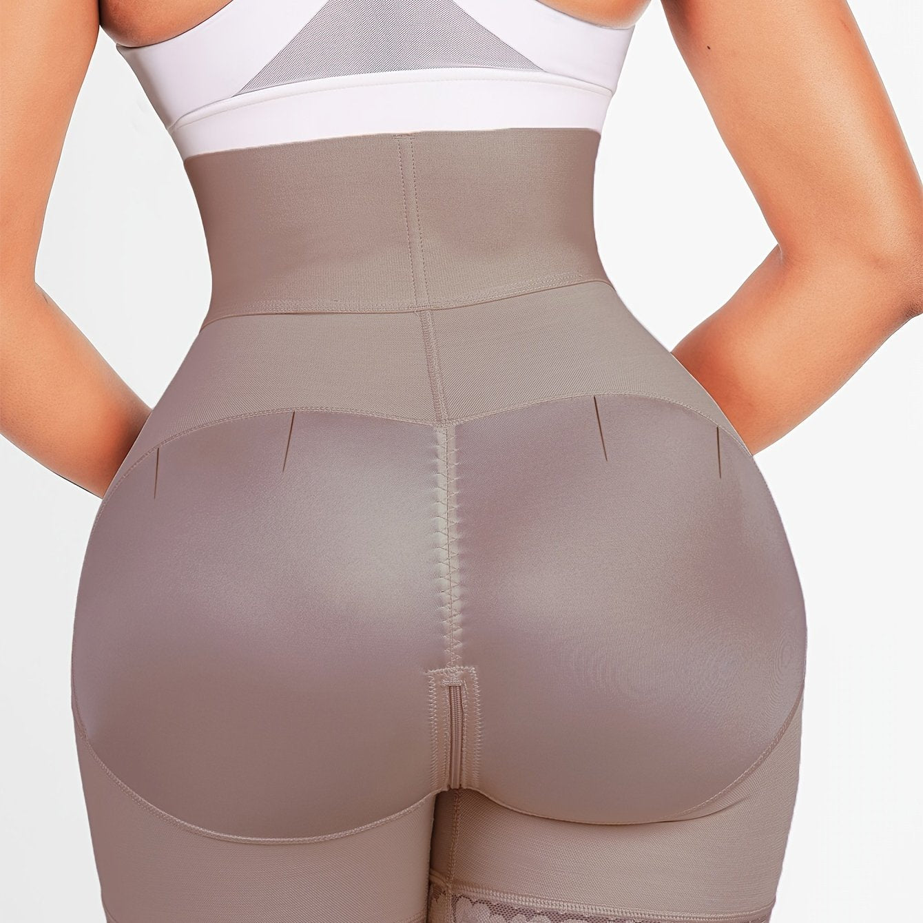 Compression tummy control panties with high waist and butt lifter for shaping the body.