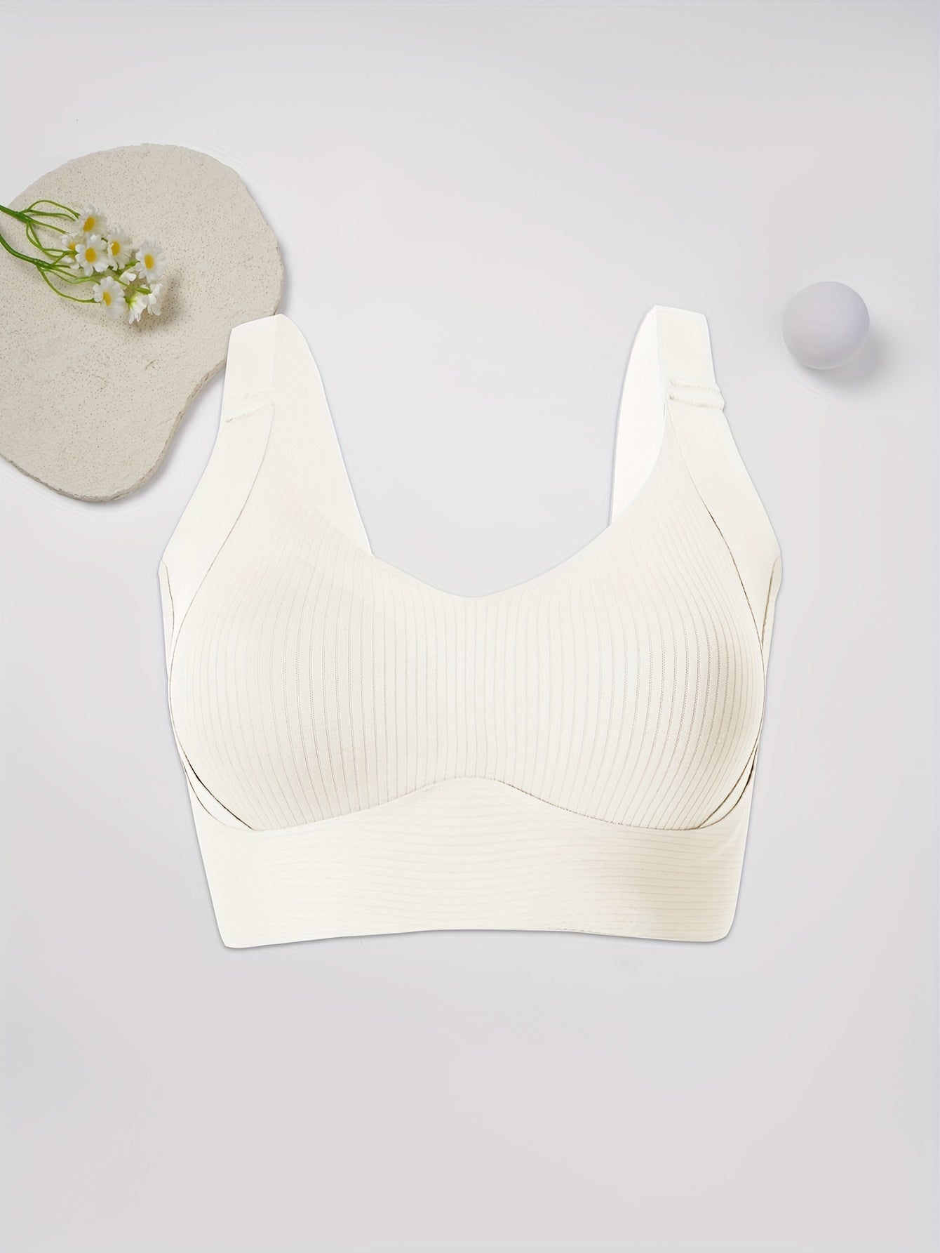 Elegant solid color bralette with soft support and medium support, made of comfortable knit fabric with wide straps.