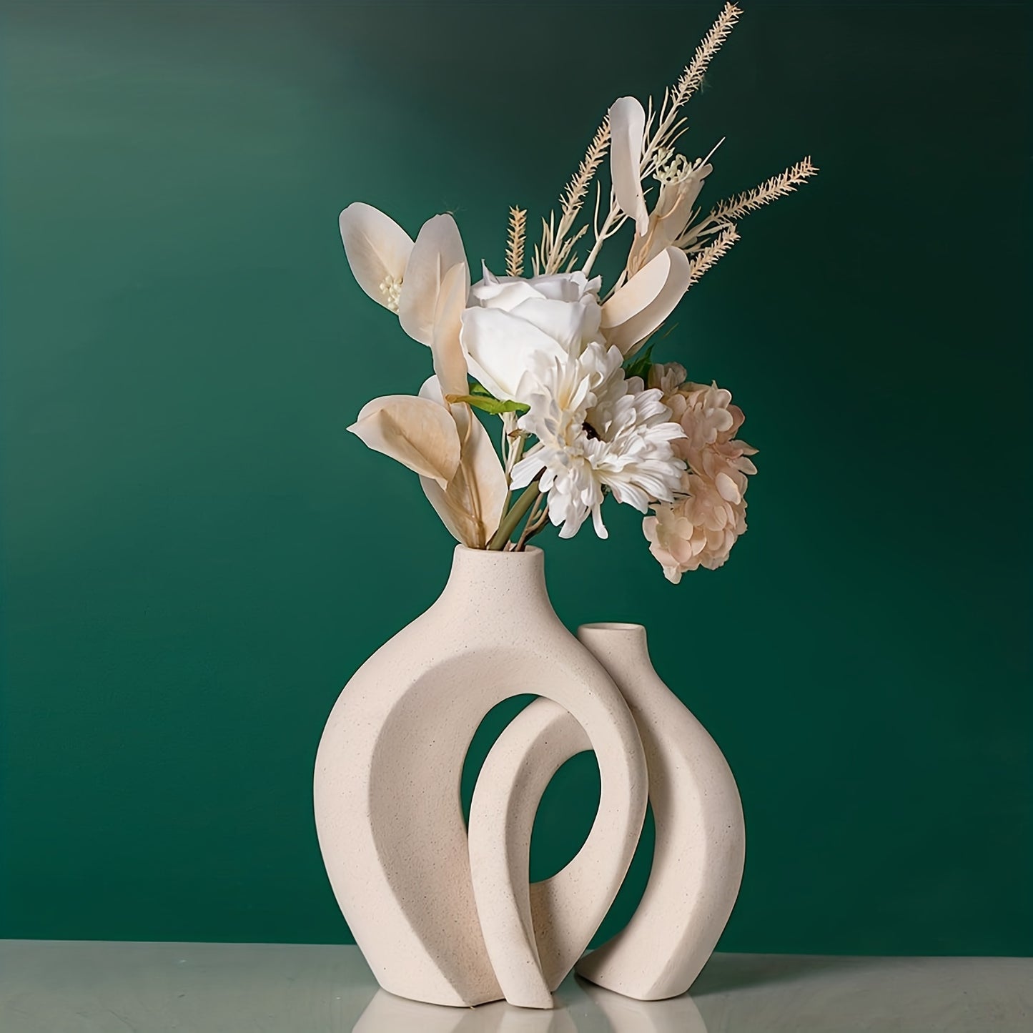 The handcrafted vase features a unique scene of couples cuddling, with two separate vases and a hollow middle that doubles as a work of art, creating a modern atmosphere no matter where it is placed.