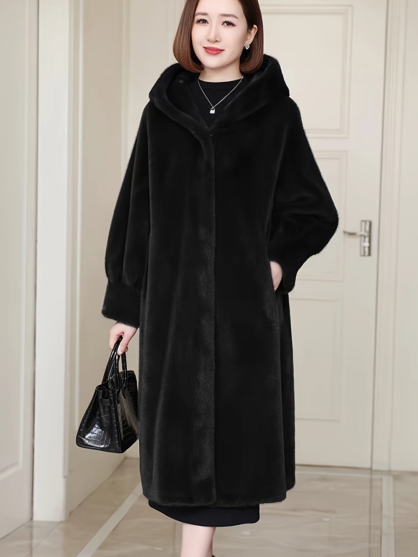 Plus Size Faux Fur Hooded Coat in Polyester Blend with Casual Style, Long Length, Raglan Sleeves, Slight Stretch, Solid Color, Flared Hem, and Knit Fabric for Fall/Winter Collection.