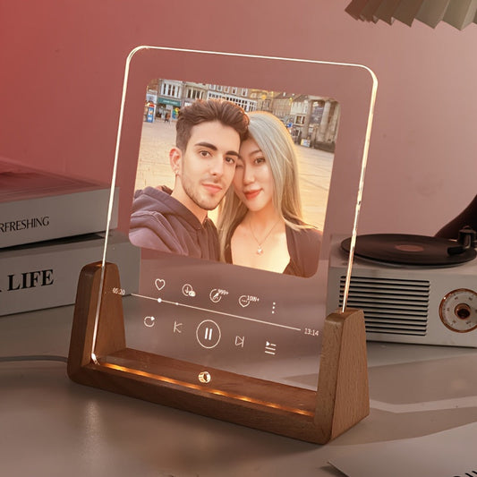 This personalized photo frame features a modern acrylic design with an LED love heart, creating a romantic atmosphere. It is USB powered and suitable for displaying a single picture on your desktop. This frame makes a creative and thoughtful birthday