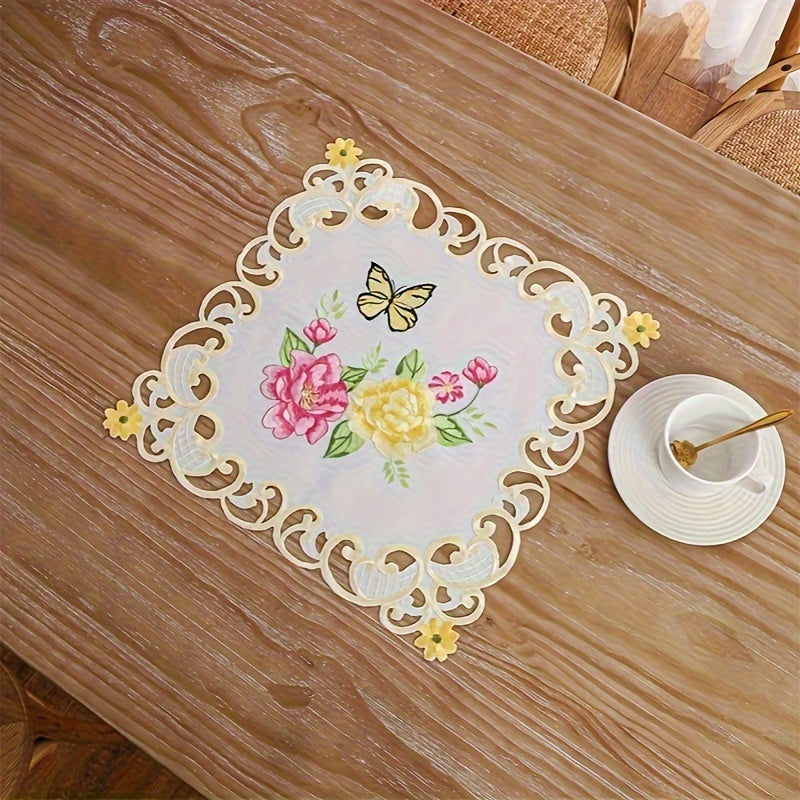 Elegant polyester table runner with hand-cut embroidered flowers and butterflies, perfect for home decor, restaurants, picnics, and parties. White base with vibrant floral patterns.