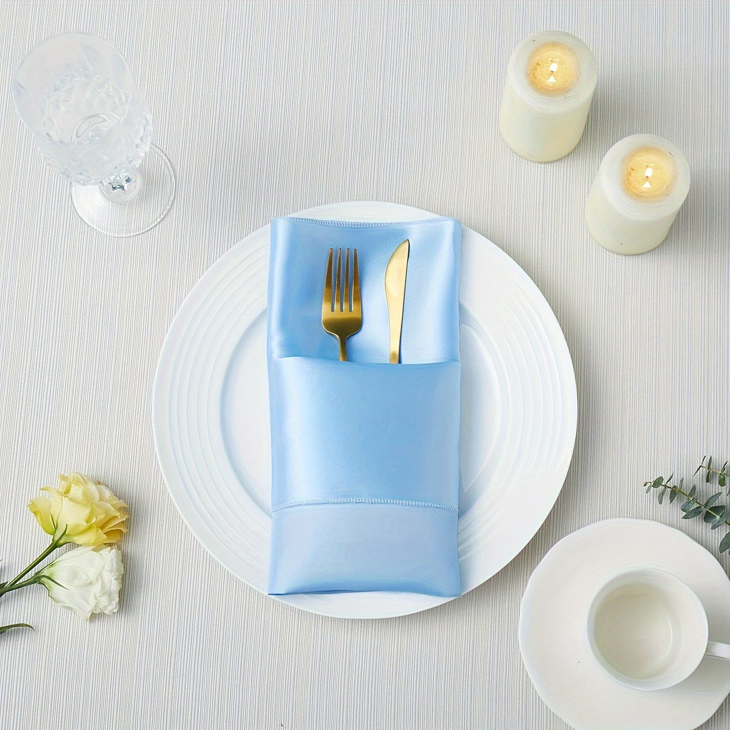 16-Pack of solid light blue square polyester napkins, 43.18x43.18 cm, for restaurant, events, and party decorations.