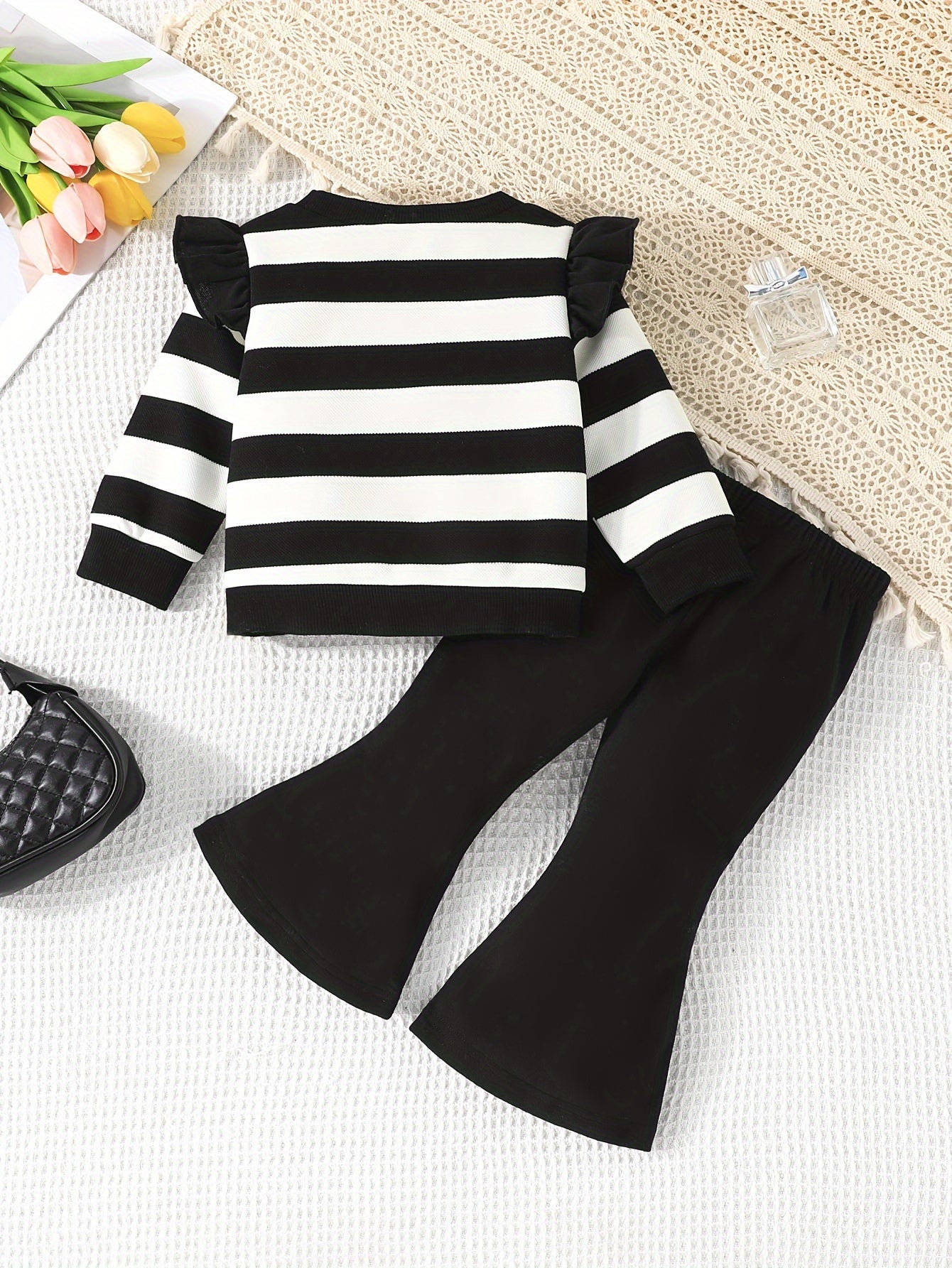 Stylish girls' casual outfit with striped top and matching bell pants, great for outdoor activities in spring and autumn.