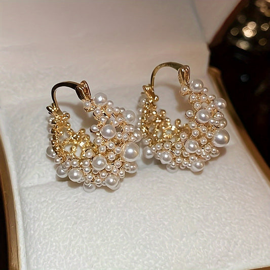 Elegant French-style U-shaped hoop earrings featuring faux pearls and beads, with a delicate hollow-out design ideal for women. A must-have accessory for vacations and parties.