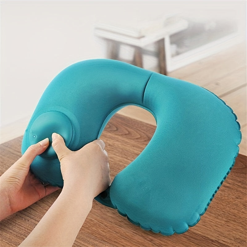 Soft and portable U-shaped inflatable pillow designed for comfortable sleeping while traveling on airplanes, trains, or in the office