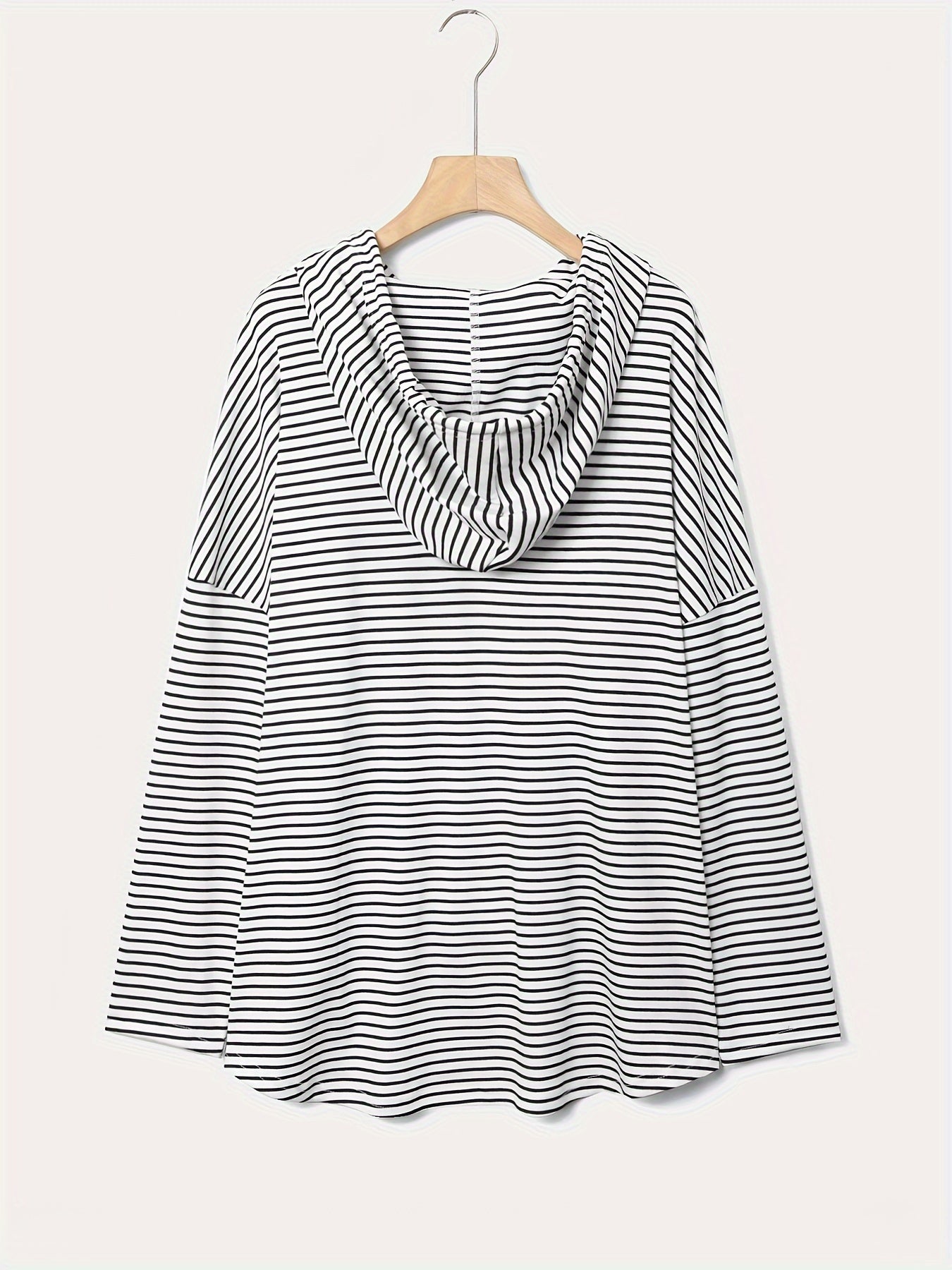 Oversized hoodie with stripes, drawstring, and machine washable polyester blend fabric, perfect for a casual and comfortable look in spring/fall.