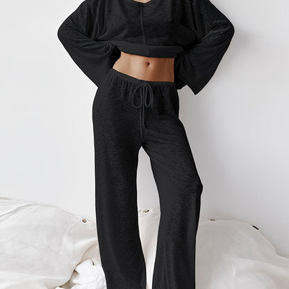 Women's two-piece set of loose and comfortable home clothes made with micro-permeable fabric, featuring round neck and long sleeves.