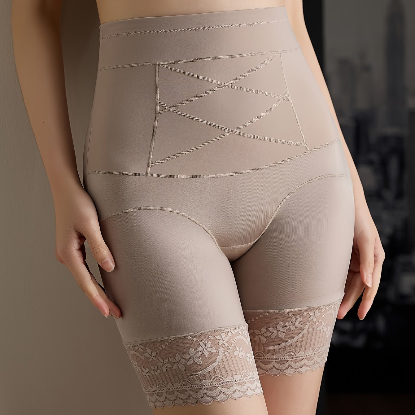 Chic tummy control thigh slimmer with lace detail, made of polyamide fabric.