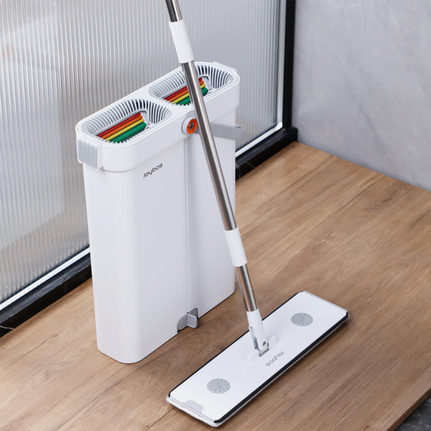 Joybos Flat Floor Mop Bucket Set includes a hands-free wash feature, narrow slit design, 2 mop pads, and is suitable for cleaning a variety of surfaces including home, car, glass, walls, and floors.