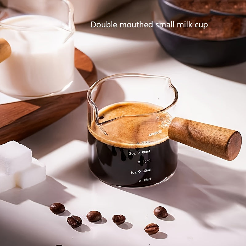 Small and stylish, this 2oz measuring cup features a heat-resistant glass body and a convenient wooden handle for easy use. With dual spout, scale markings, and ideal for measuring small quantities, this cup is perfect for both coffee and kitchen use.