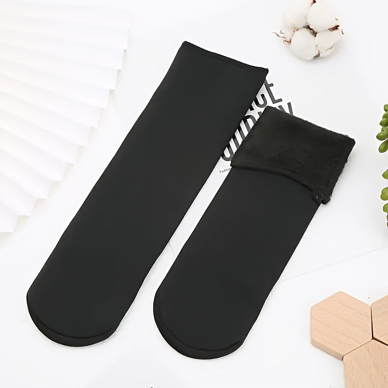 5 pairs of women's crew socks made of soft fuzzy polyester blend, perfect for cold weather. Machine washable.