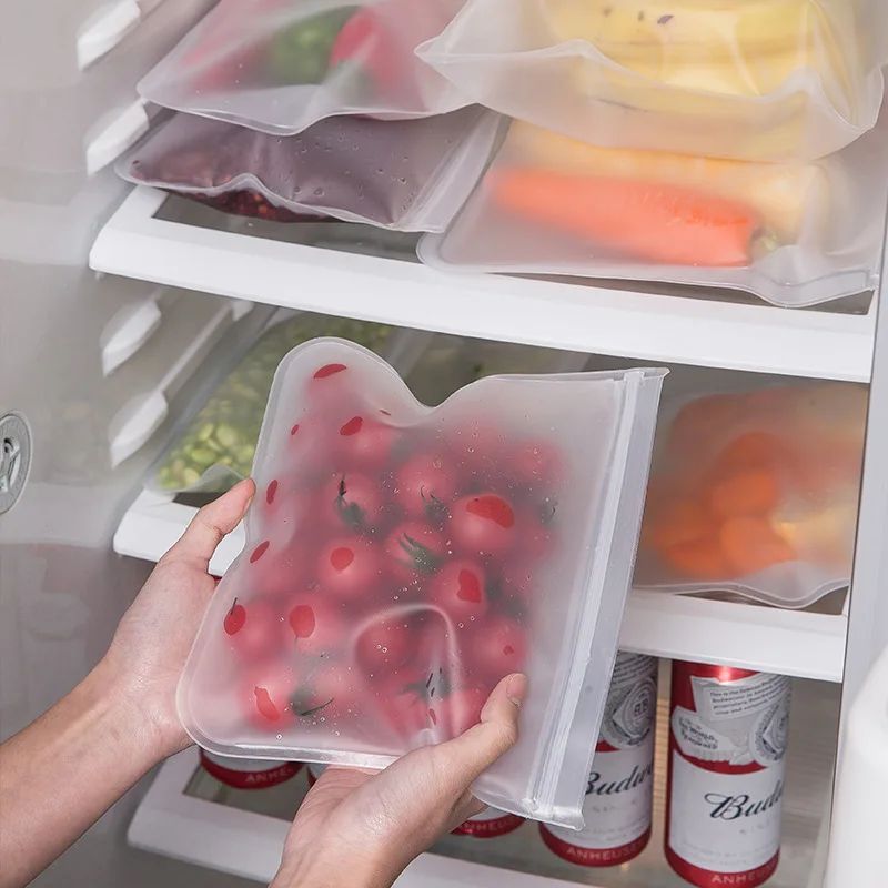 Food safe reusable stand up zip bags made from polyethylene silicone, designed with leak-proof technology for fresh food preservation. The bags feature a rectangular shape and an in-line skate design for easy storage and transportation.