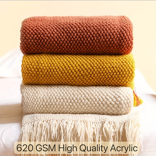 Stay cozy and stylish with this elegant knit throw blanket, featuring tassels for added flair. Made of lightweight acrylic with a bubble textured design, this blanket offers all-season comfort. Perfect for use on the couch, bed, or as home decor, as well