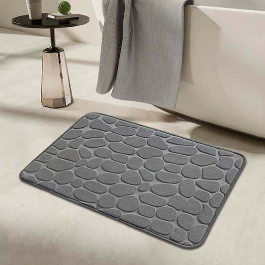 Luxurious red memory foam bath mat with geometric pattern for bathroom floors. Non-slip, soft polyester material that is quick-drying and absorbent. Hand washable, fragrance-free with a textured surface and machine-knit design. Perfect for a quick dry