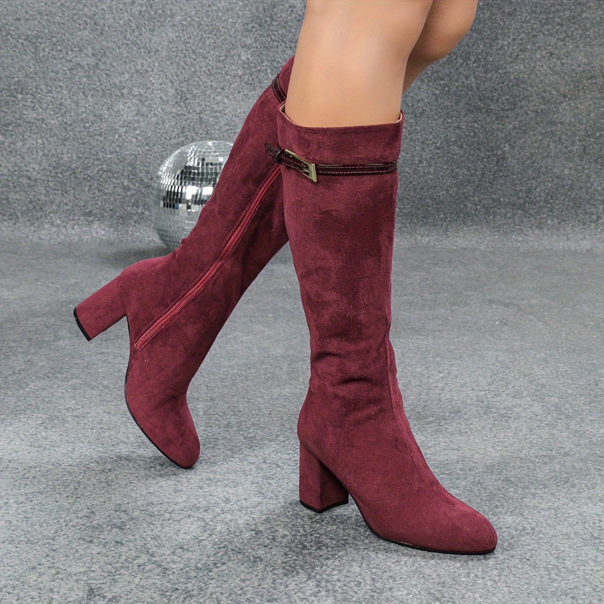 Burgundy side zip round toe knee-high boots with chunky heels.