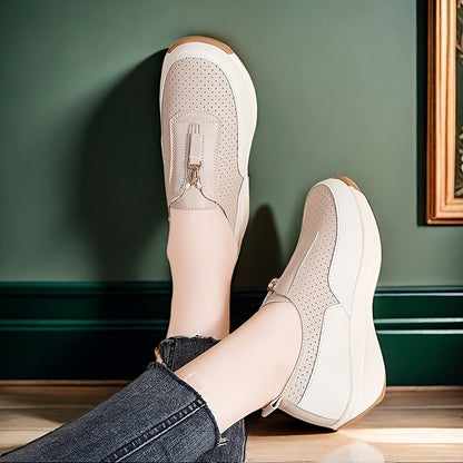 Beige perforated women's casual sneakers with zipper detail, thick sole, and anti-slip features.