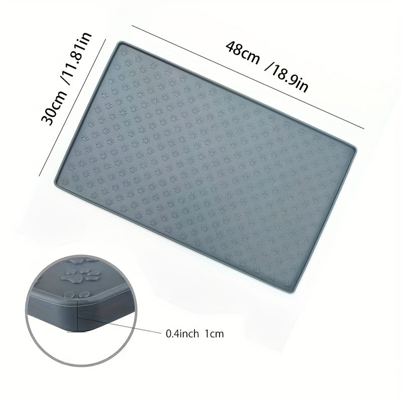 Silicone pet food mat with raised edge.