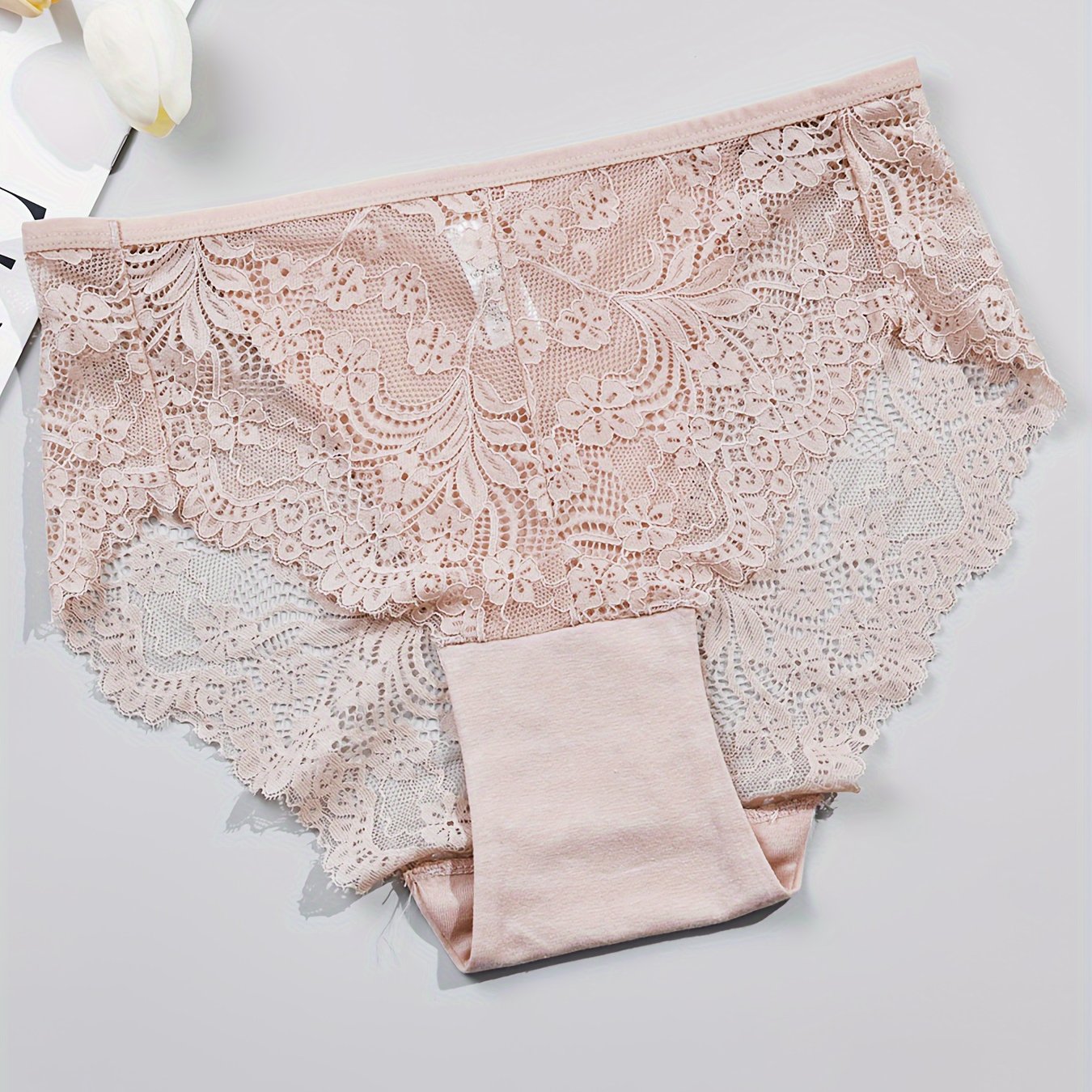 1 pair of women's lace-trimmed brief panties made from soft, breathable nylon blend for everyday wear, sleep, dates, and light sports. Cute and semi-transparent design.