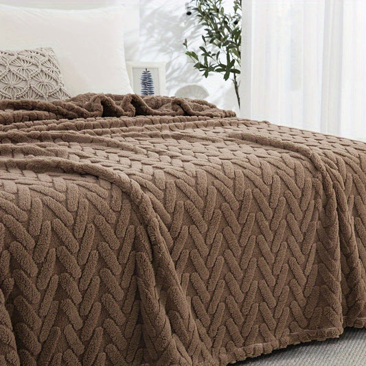 One piece of a high-weight, double-sided plush fleece throw blanket in a contemporary brown style. This blanket is machine washable and suitable for all seasons. Made of knitted polyester with a jacquard design, it features no prints and is perfect for