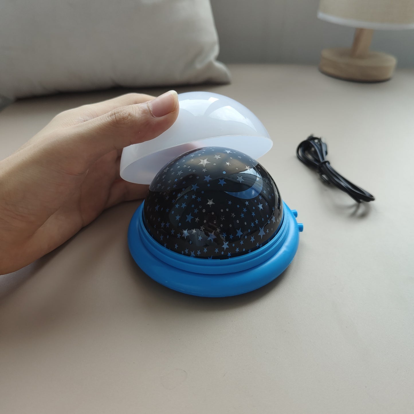 1pc Vibrant UFO Starry Night Sky Projector Lamp with 8 color modes, can be powered by USB or batteries (not included). Modern space-themed desk light with polished finish to create dynamic ambiance in any room.