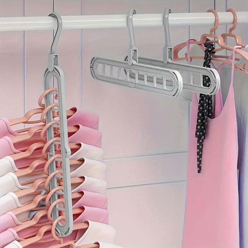 Space-saving multi-hole clothes hanger for home, dorm, and travel - foldable drying rack for trousers, shirts, and skirts, also doubles as a shower caddy.