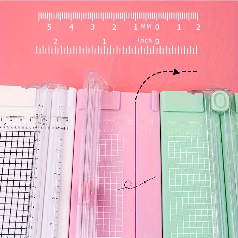 Compact sliding paper cutter for A4 paper, photos, copy paper, and stationery. Dual-direction design with measuring ruler. Available in bright pink, purple, green, blue, and black. Compact