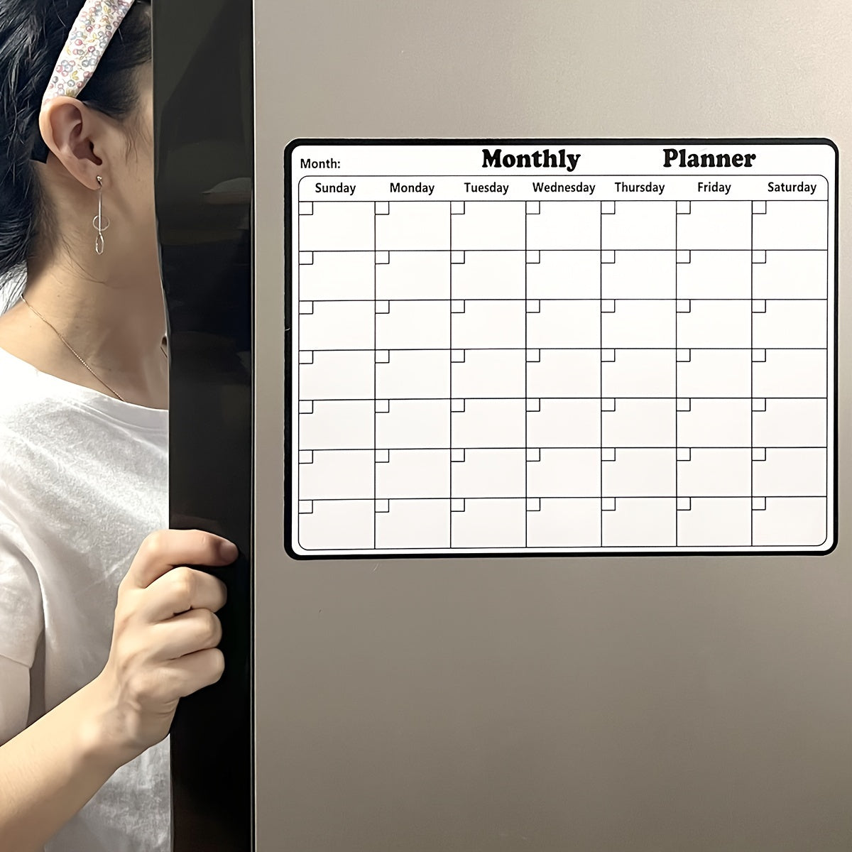 One piece of a dry erase fridge magnetic calendar, featuring a white board design perfect for refrigerators. This magnetic calendar is great for keeping track of appointments and events in the kitchen, serving as a decorative and functional addition to