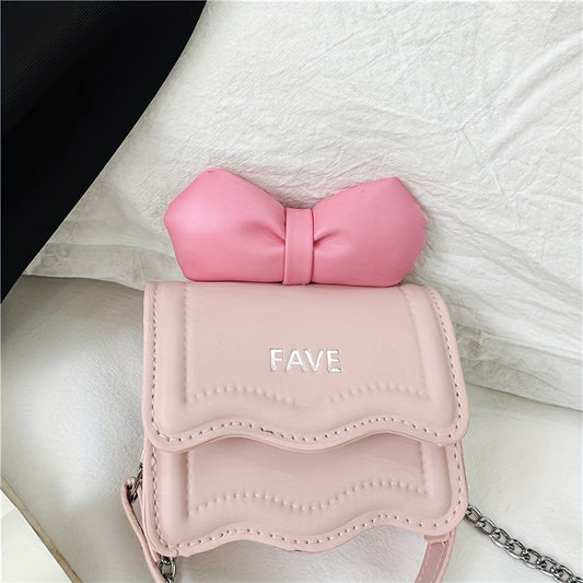 Stylish youngsters' crossbody bag in pink with bow accent and "FAVE" embossed flap. Lightweight, adjustable strap, casual sporty design, easy to clean. Perfect for daily commute.