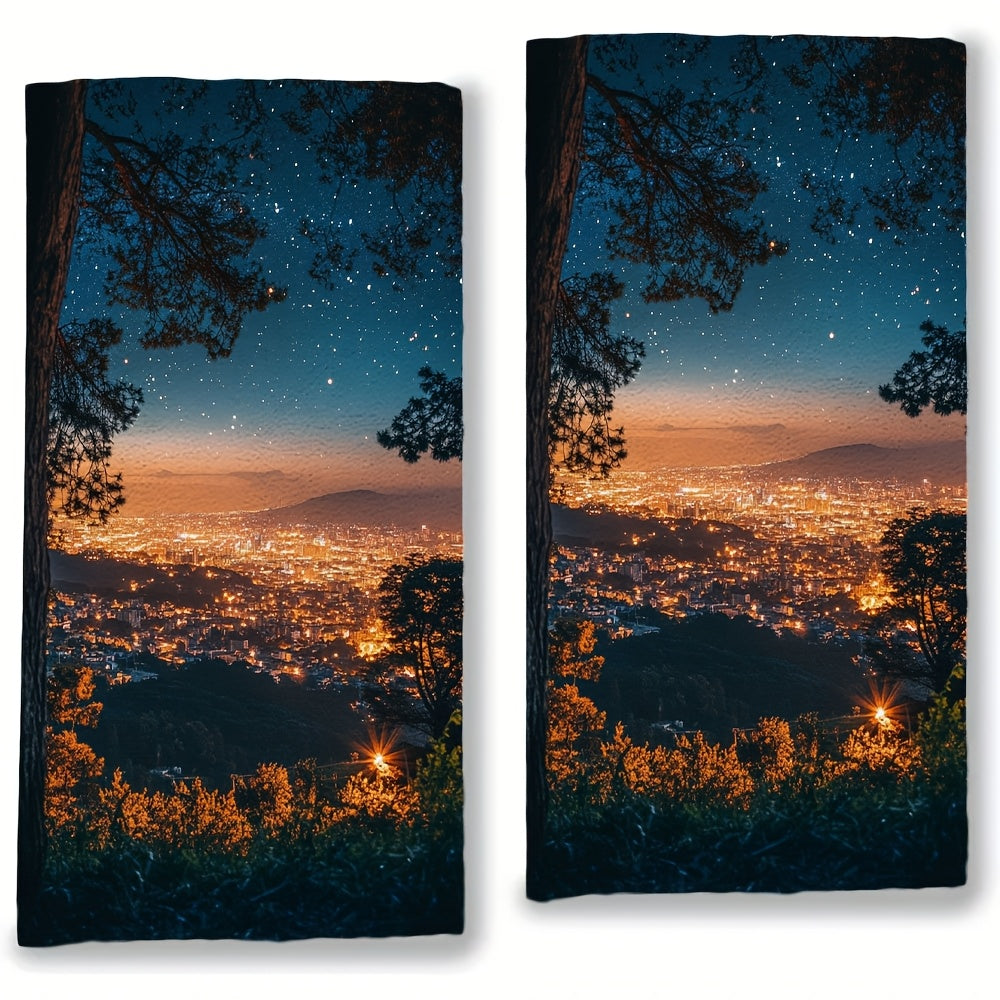 Two Coastal Style Kitchen Towels made of super absorbent polyester knit fabric. These contemporary oblong hand towels feature a sparkling city night view and are machine washable. Each towel measures 40.64x60.96 cm.