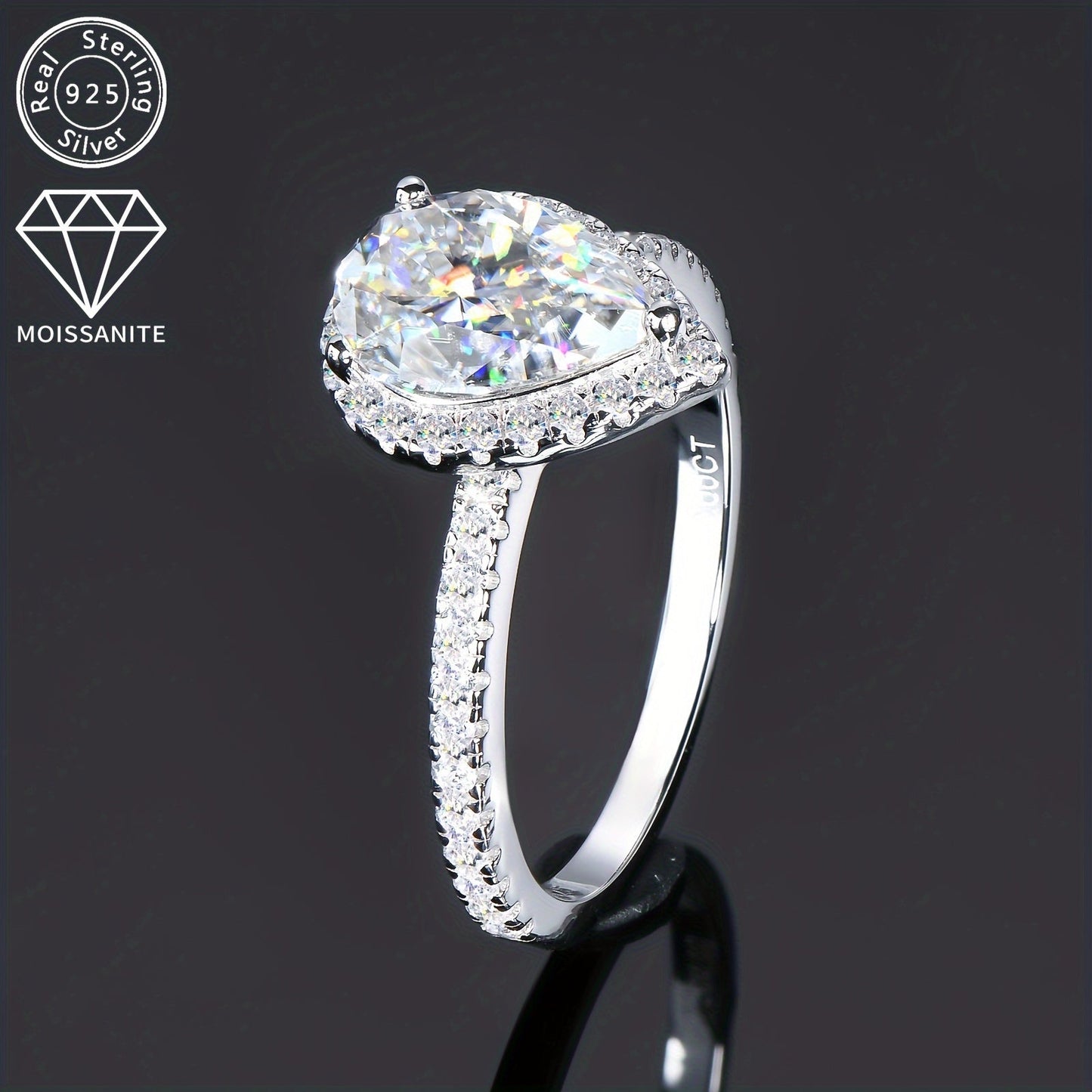 925 Sterling Silver Women's Engagement Ring featuring a center Moissanite pear-shaped stone measuring 7x10mm and weighing 2 carats. Surrounding the center stone are additional Moissanite stones, creating a stunning teardrop shape. This ring is perfect