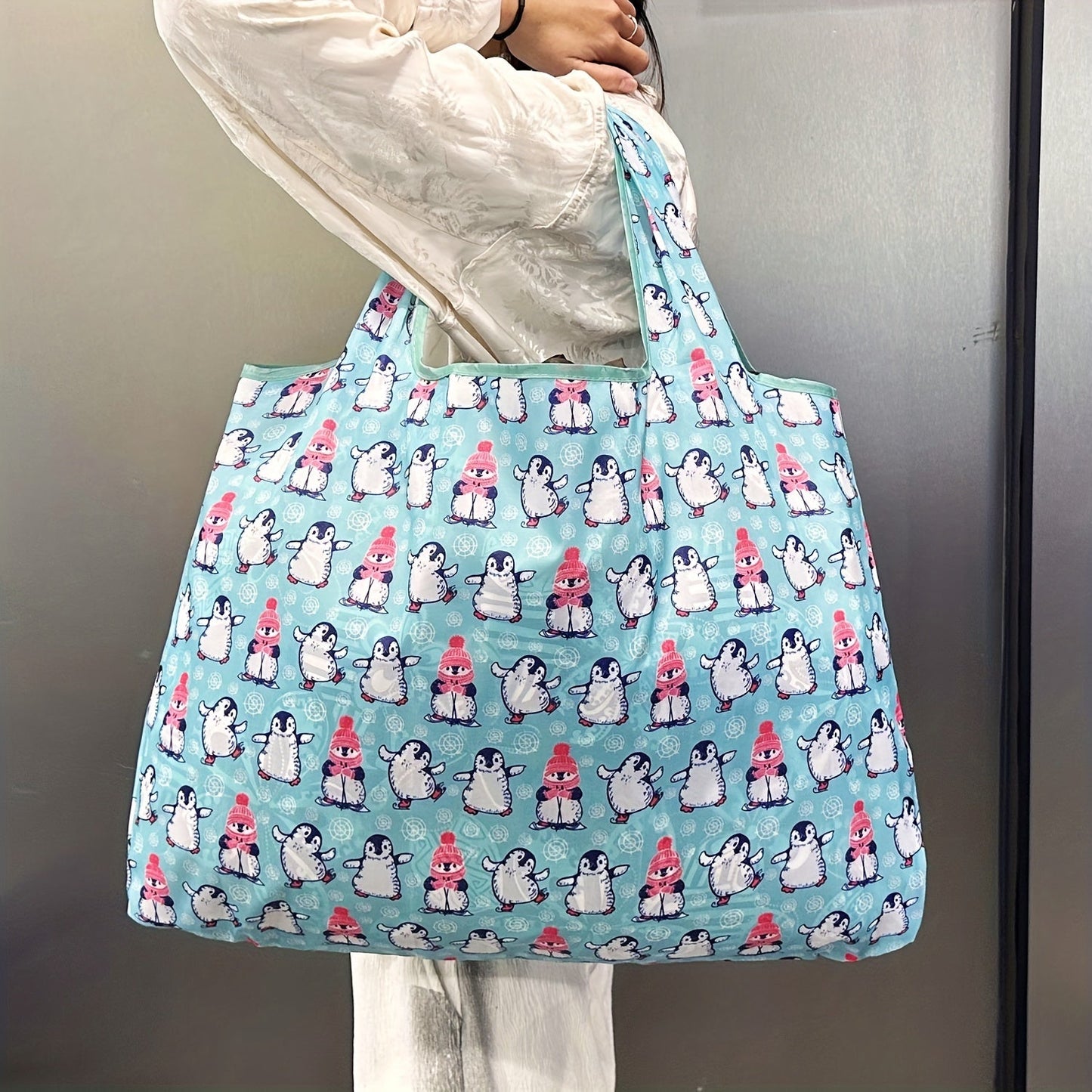 Durable and Lightweight Penguin Pattern Tote Bags - Perfect for Shopping, Groceries, and Everything in Between! These reusable and foldable totes are also recyclable, water resistant, and compact enough to fit in your pocket.