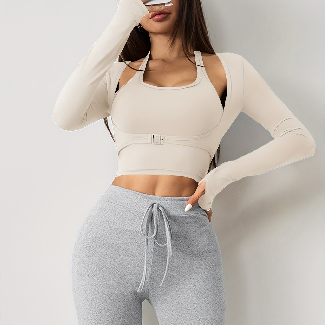 Women's long sleeve yoga top with built-in bra, seamless sports crop top for fall and winter seasons.