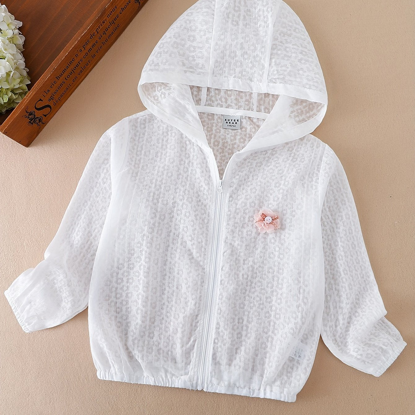 Lightweight zip-up sunscreen jacket for girls with flower decor, perfect for summer.